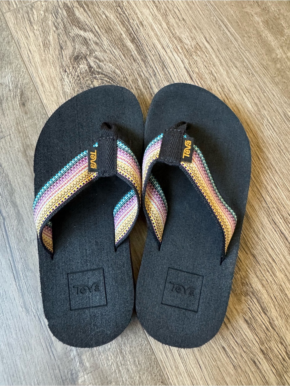 Teva Kids Black Flip Flops with Rainbow Striped Straps